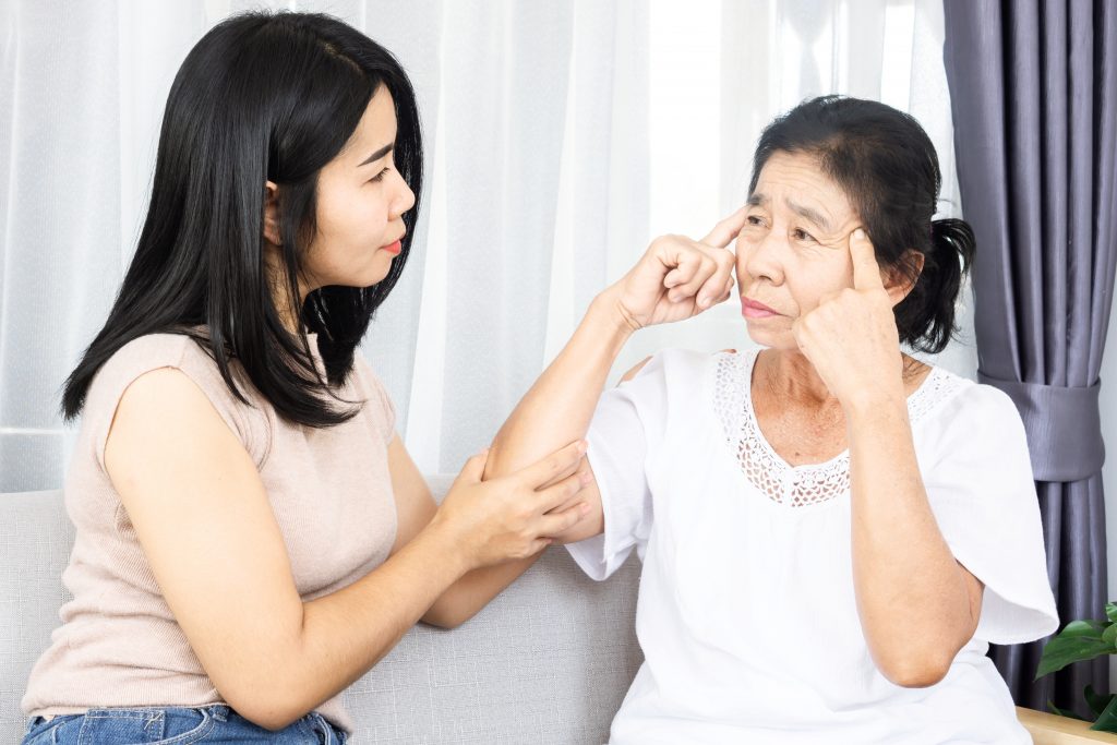 daughter with her mother who has memory issues or alzheimer's disease