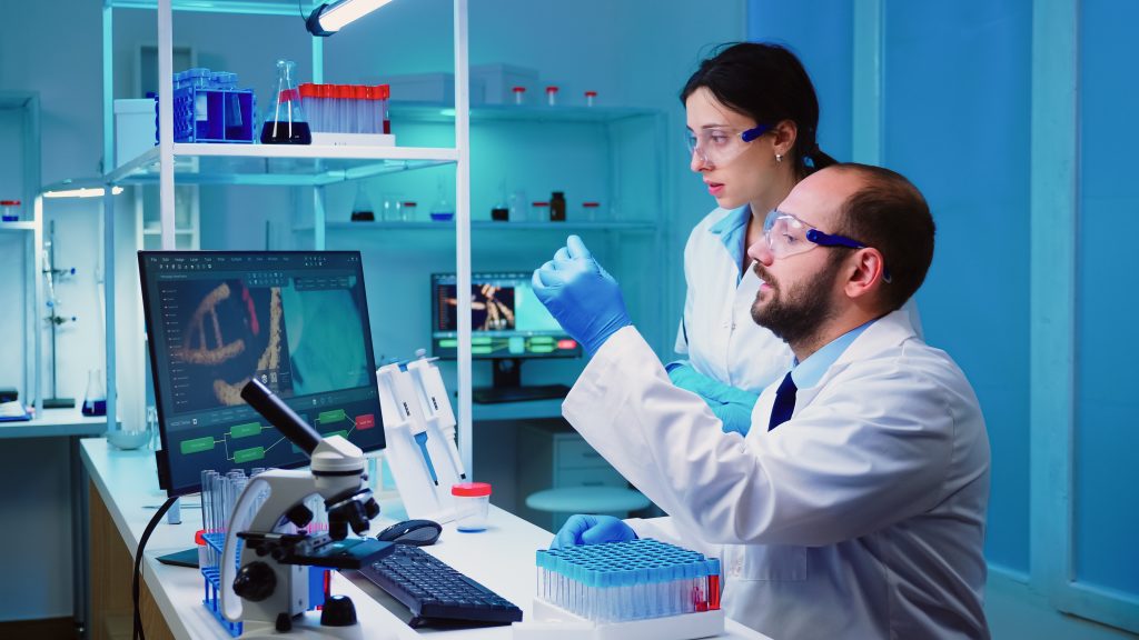 two scientists testing DNA genetics in a lab