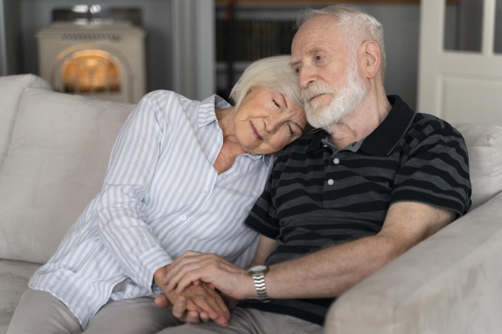 old couple with alzheimer's diseases comforting each other